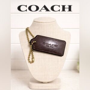 Coach dark burgundy Leather Coach hang tag
